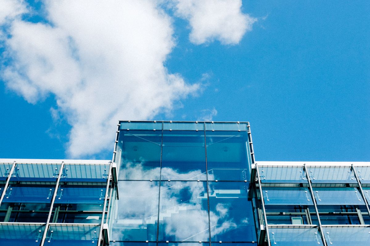 A modern glass office building in the city