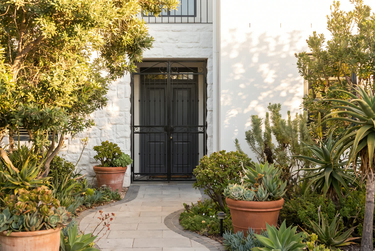 A Cape Town family home with its front entrance and security gate